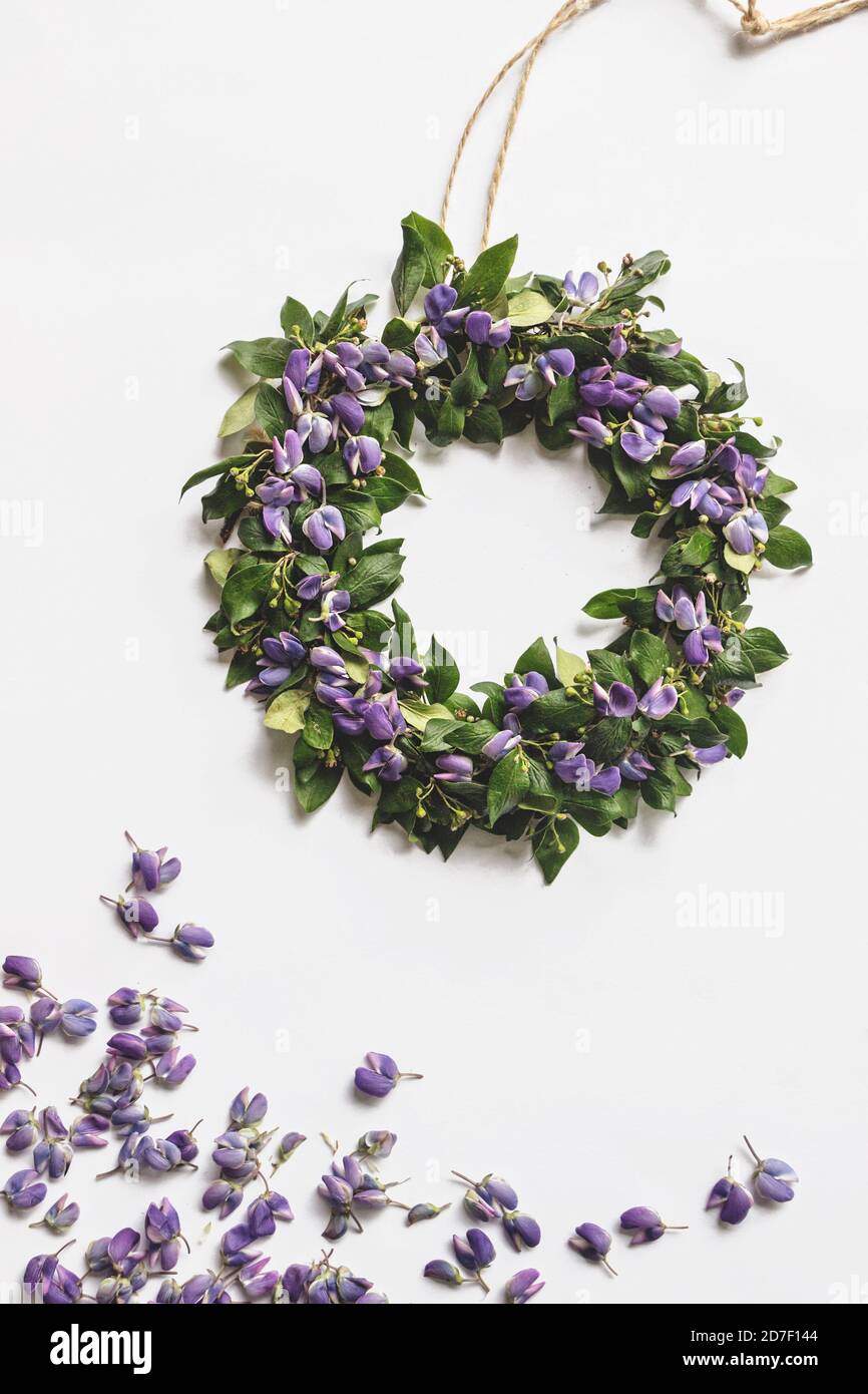 DIY midsummer flower wreath flat lay on white background Stock Photo