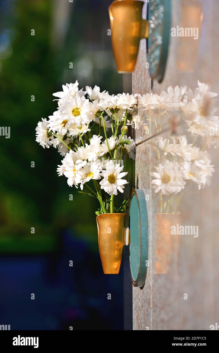 Flowers in a vase on the mausoleum wall Stock Photo Alamy