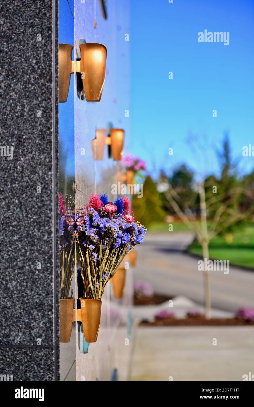 Flowers in a vase on the mausoleum wall Stock Photo Alamy
