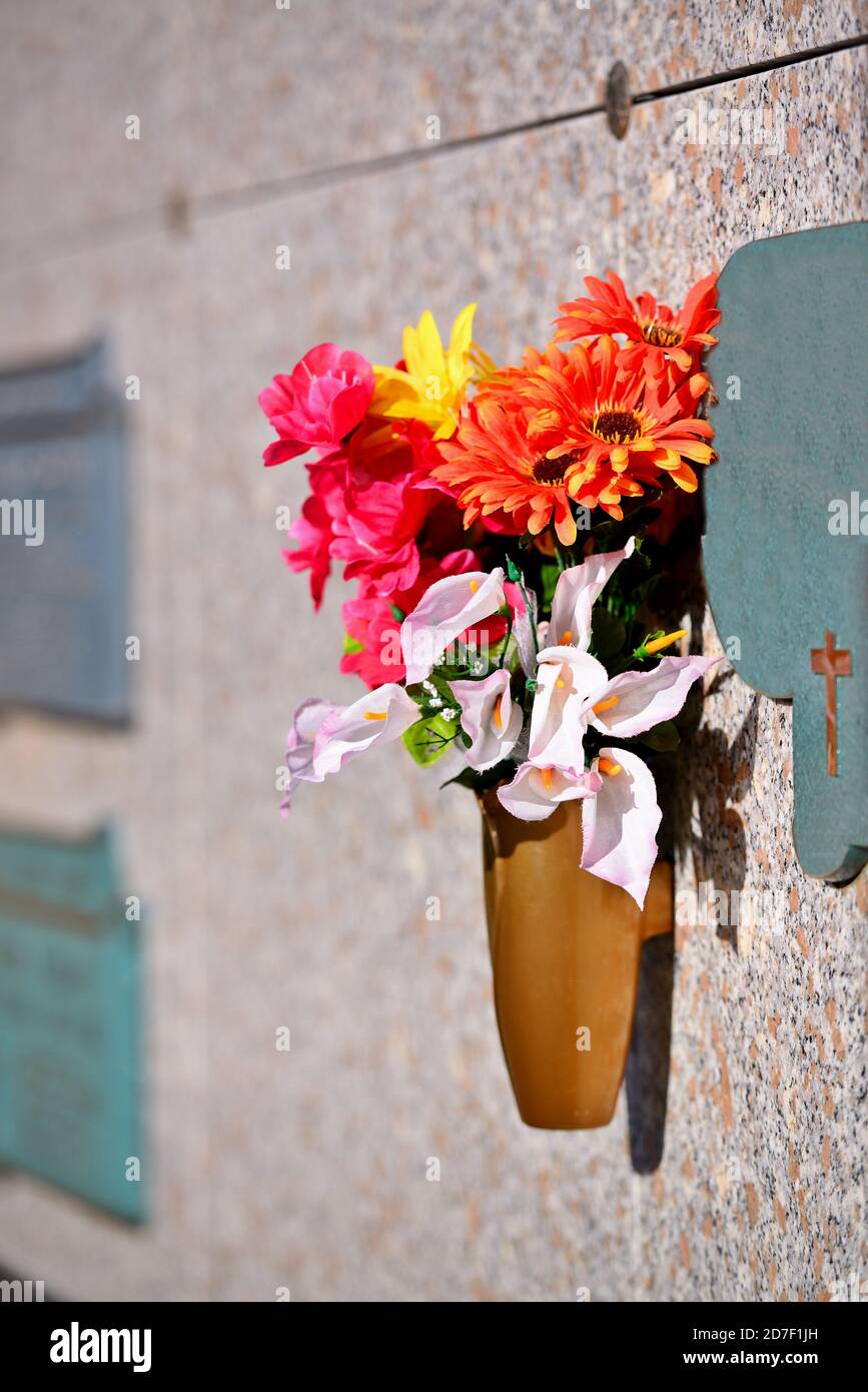 Flowers in a vase on the mausoleum wall Stock Photo Alamy