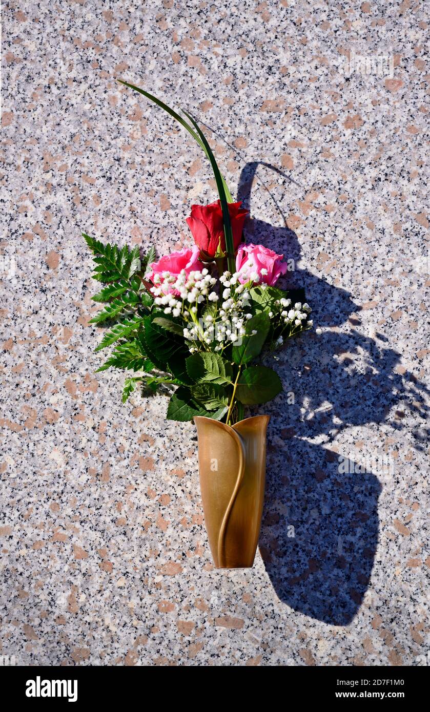 Flowers in a vase on the mausoleum wall Stock Photo Alamy