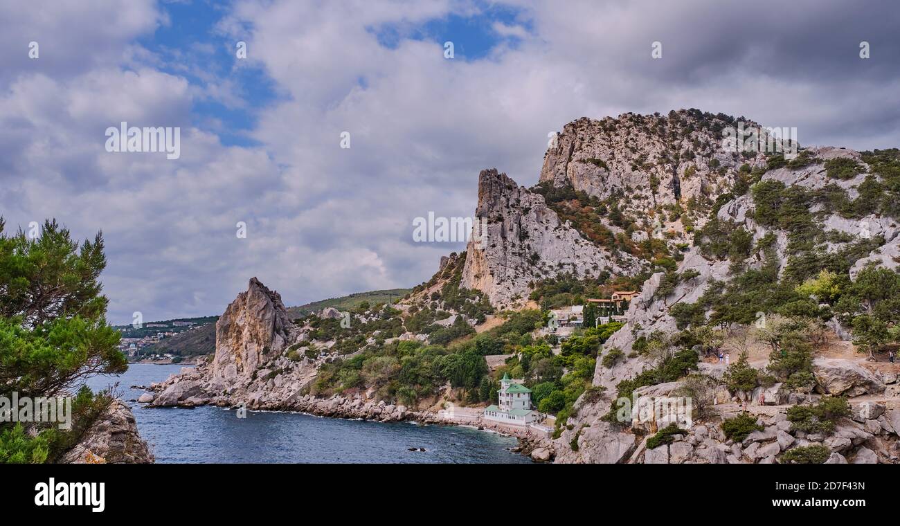 Coastal seascape landscape. Mount Cat, Koshka, the black sea coast near Yalta, town Simeiz, Crimea. Banner. Stock Photo