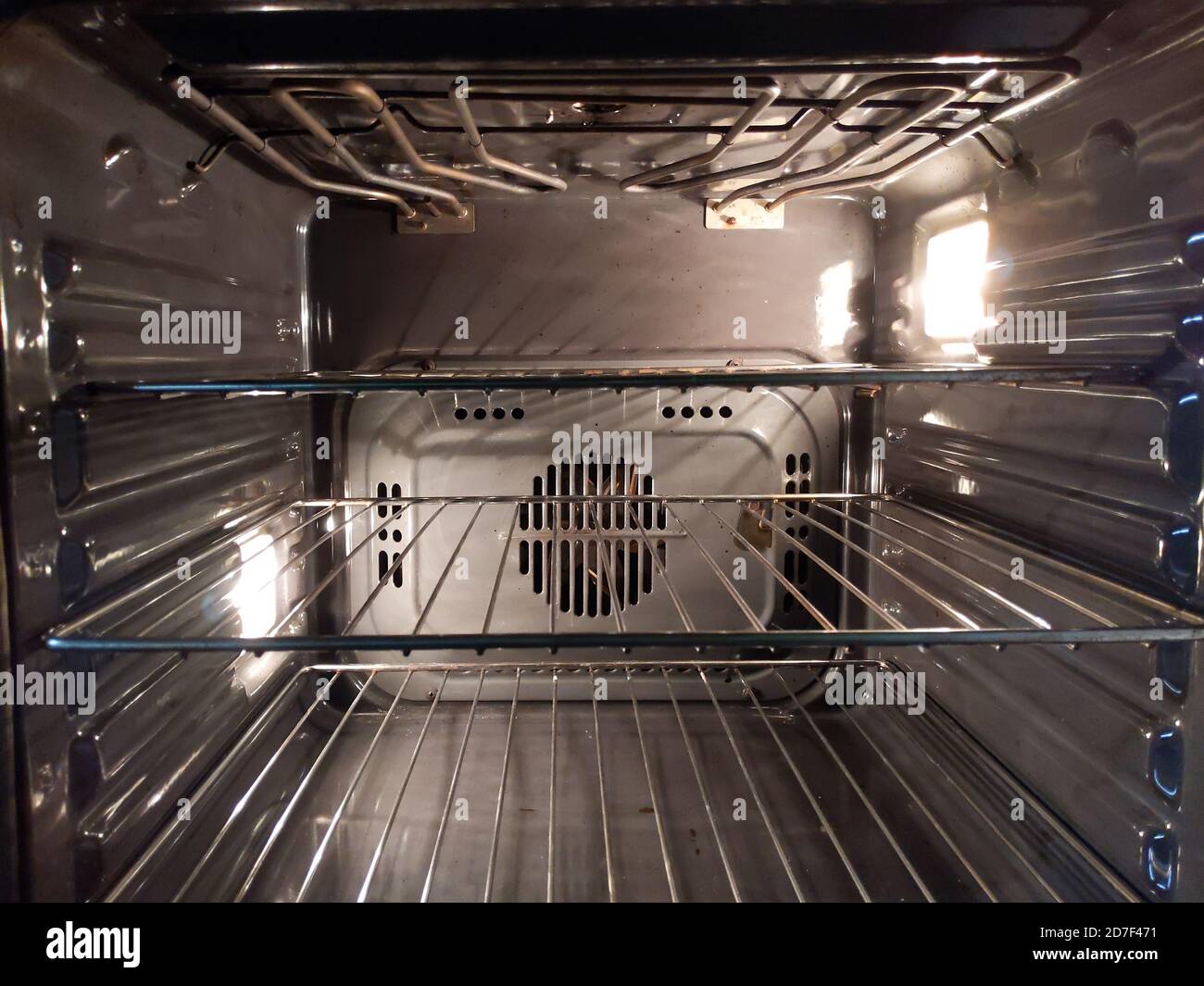 New Modern Empty open electric oven with hot air ventilation, light is