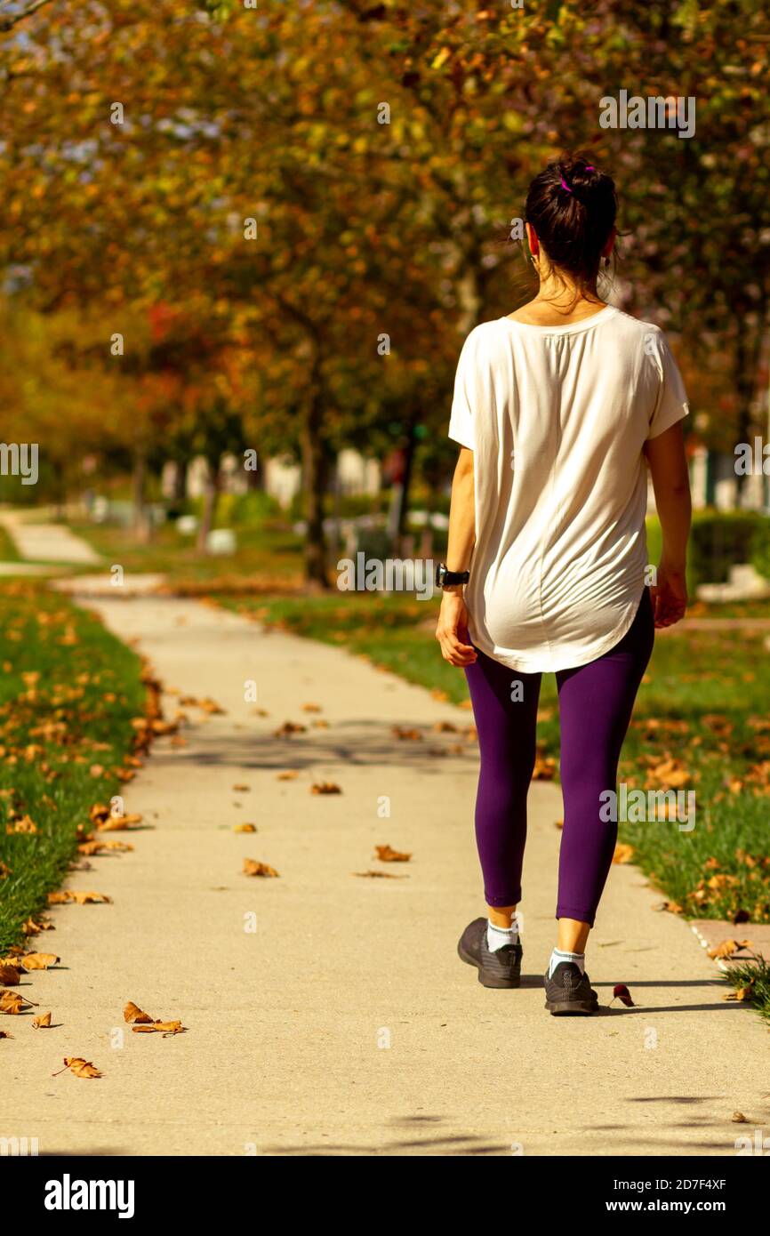 Beautiful woman hiking leaves hi-res stock photography and images - Alamy