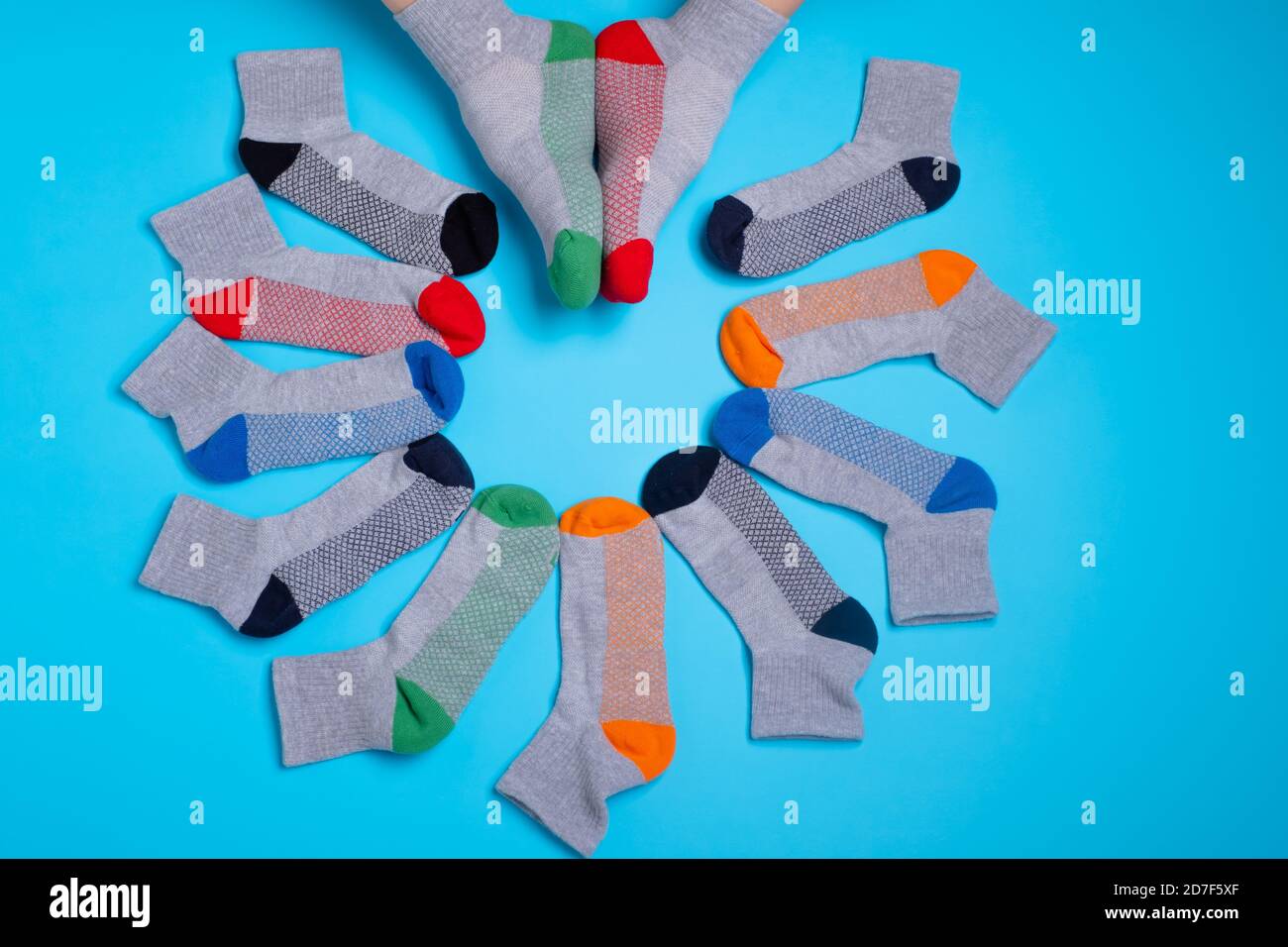 colored socks in a around on a blue background Stock Photo