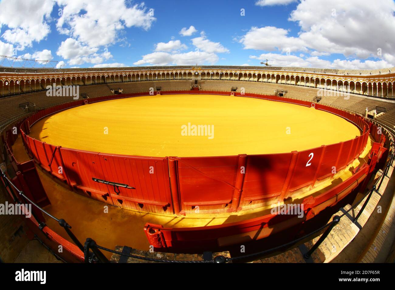 Plaza de Toros in Sevilla, Spain. The yellow of the sand and the red of the fence are the colors of spanish flag. Stock Photo