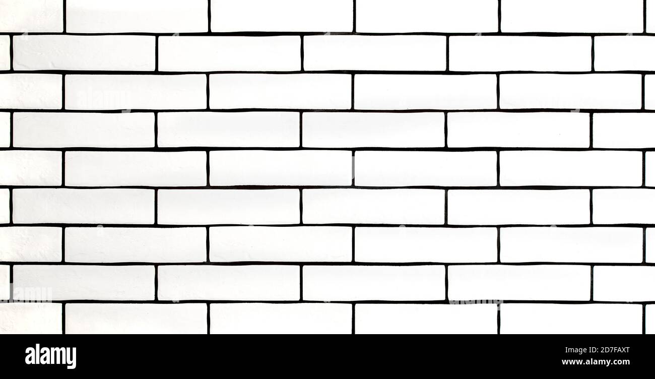 White brick wall. Background with white ceramic tiles. Space for text. Stock Photo