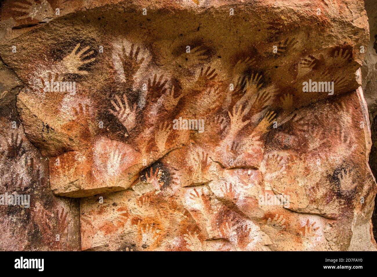 CUEVAS DE LAS MANOS, ARGENTINA. Many caves along the rio pinturas are decorated by prehistoric paintings, many of them stencilled hand prints Stock Photo
