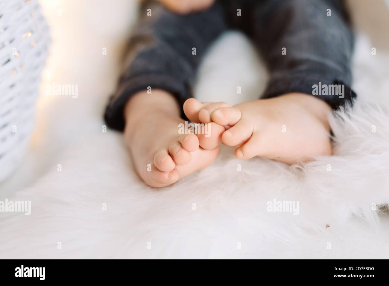 Baby feet on light blanket Stock Photo Alamy