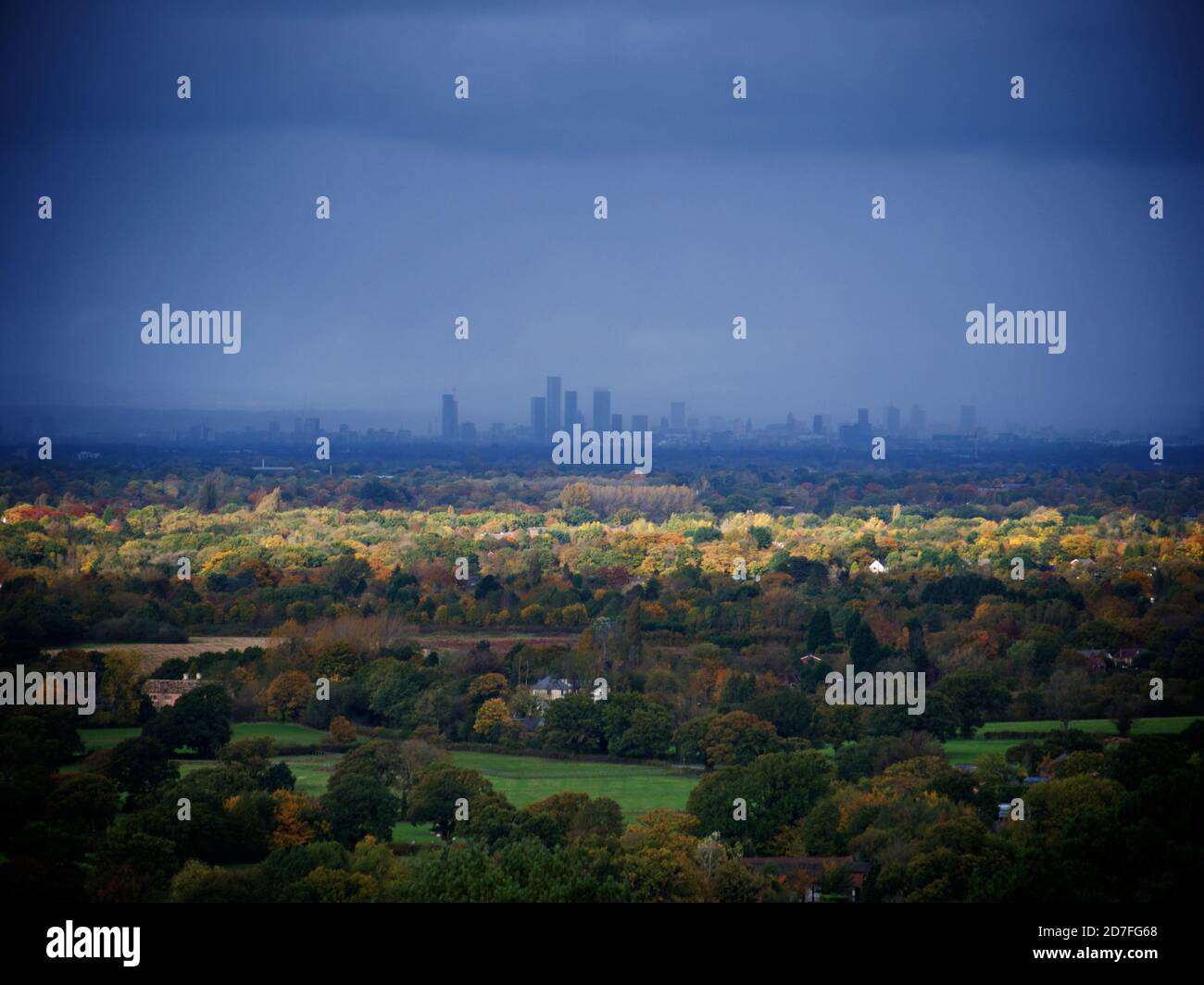 The Manchester skyline seen from Alderley Edge across the Cheshire countryside Stock Photo