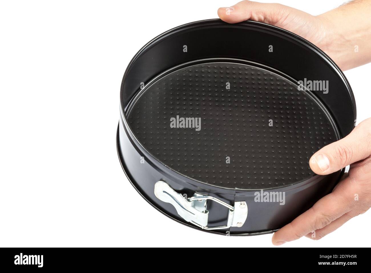 Baking dish in hand isolated on white background Stock Photo - Alamy