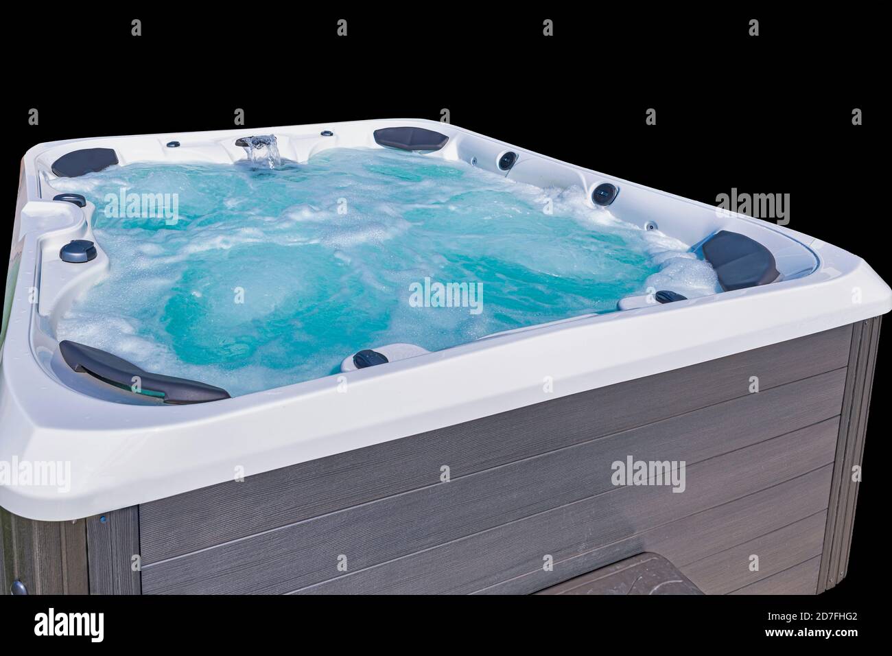 Hot tub, running jets, bubbly emerald green water, isolated on black
