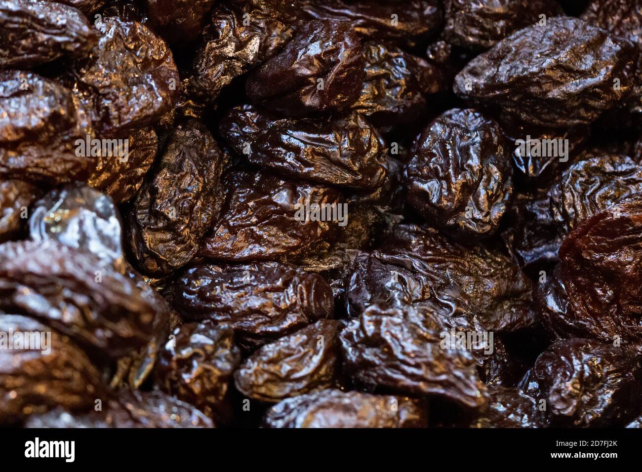 Organic, healthy prunes, dried plums, on display for sale on a market