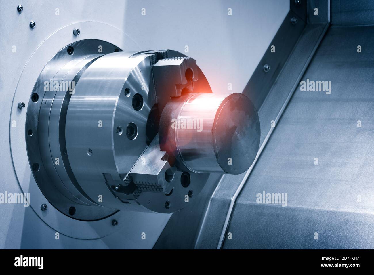 CNC lathe machine or Turning machine with rotating spindle with metal part industrial