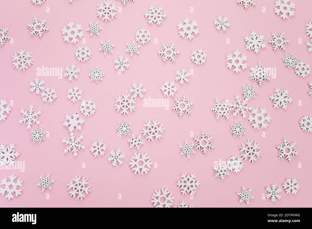 Snow flakes pattern on pink background. Top view Stock Photo