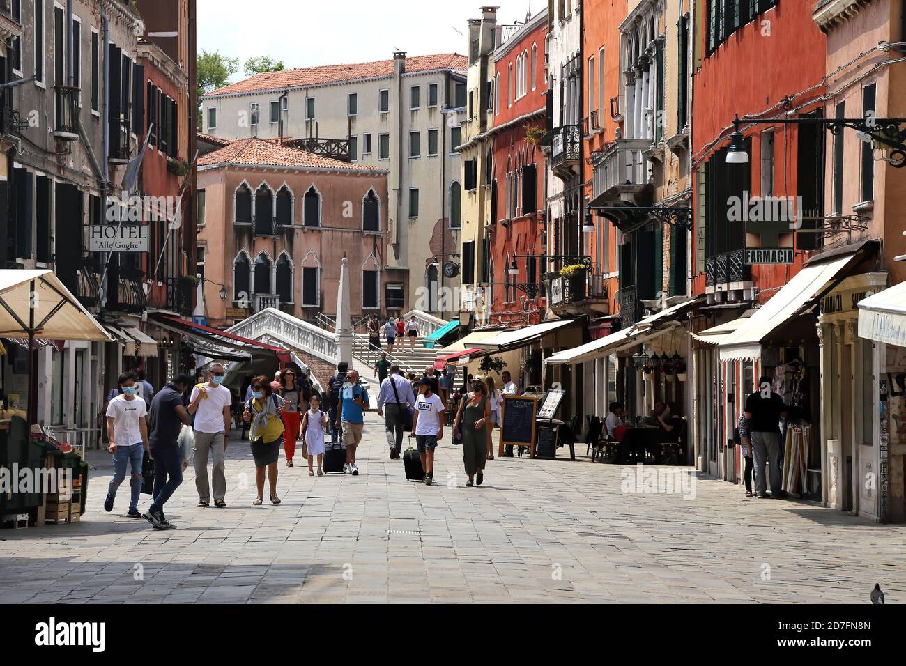 Venice, Italy. June 24, 2020. First tourists walking on a street of Venice historic centre city after the Italian lockdown for the covid-19 pandemic c Stock Photo
