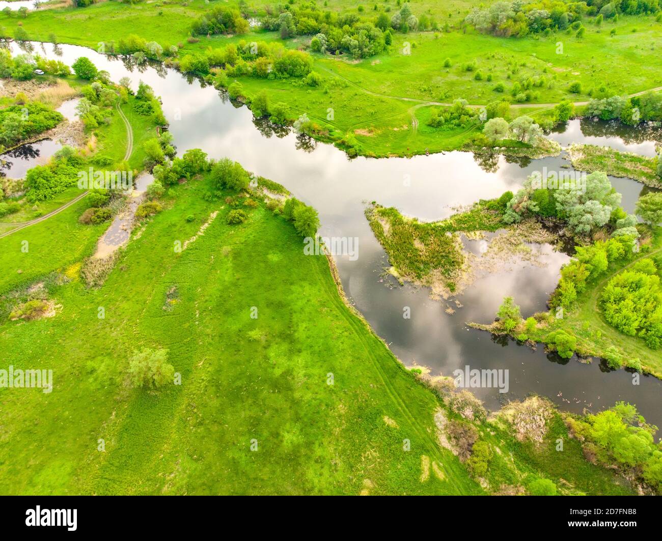 aerial drone landscape of river in green field, top view of beautiful ...