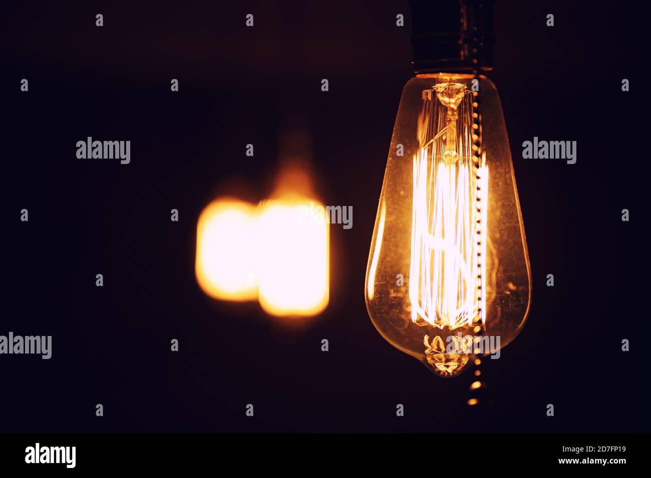 Lamps with tungsten filament. Edison light bulb. Filament filament in