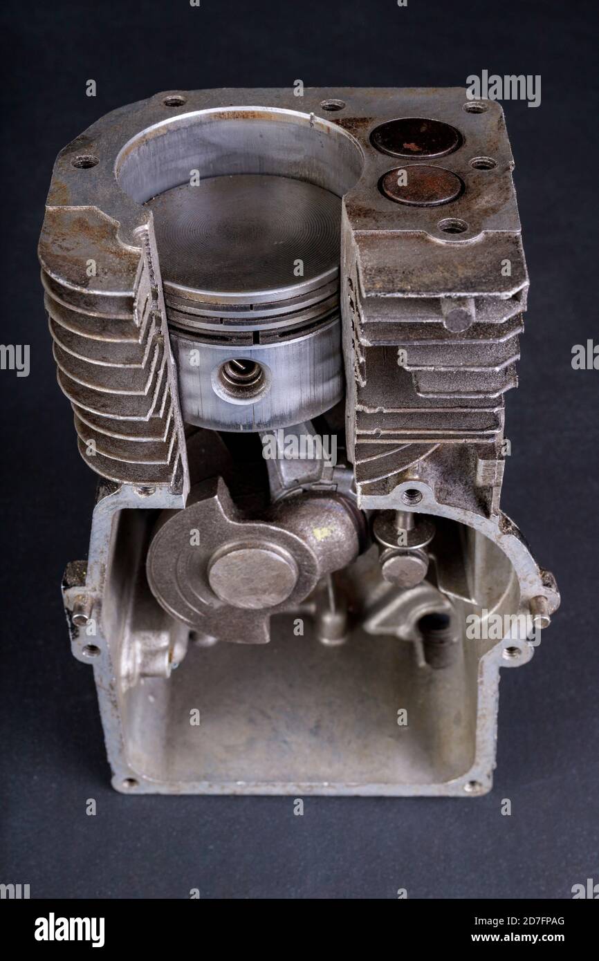 A small internal combustion engine shown in section. View of the piston
