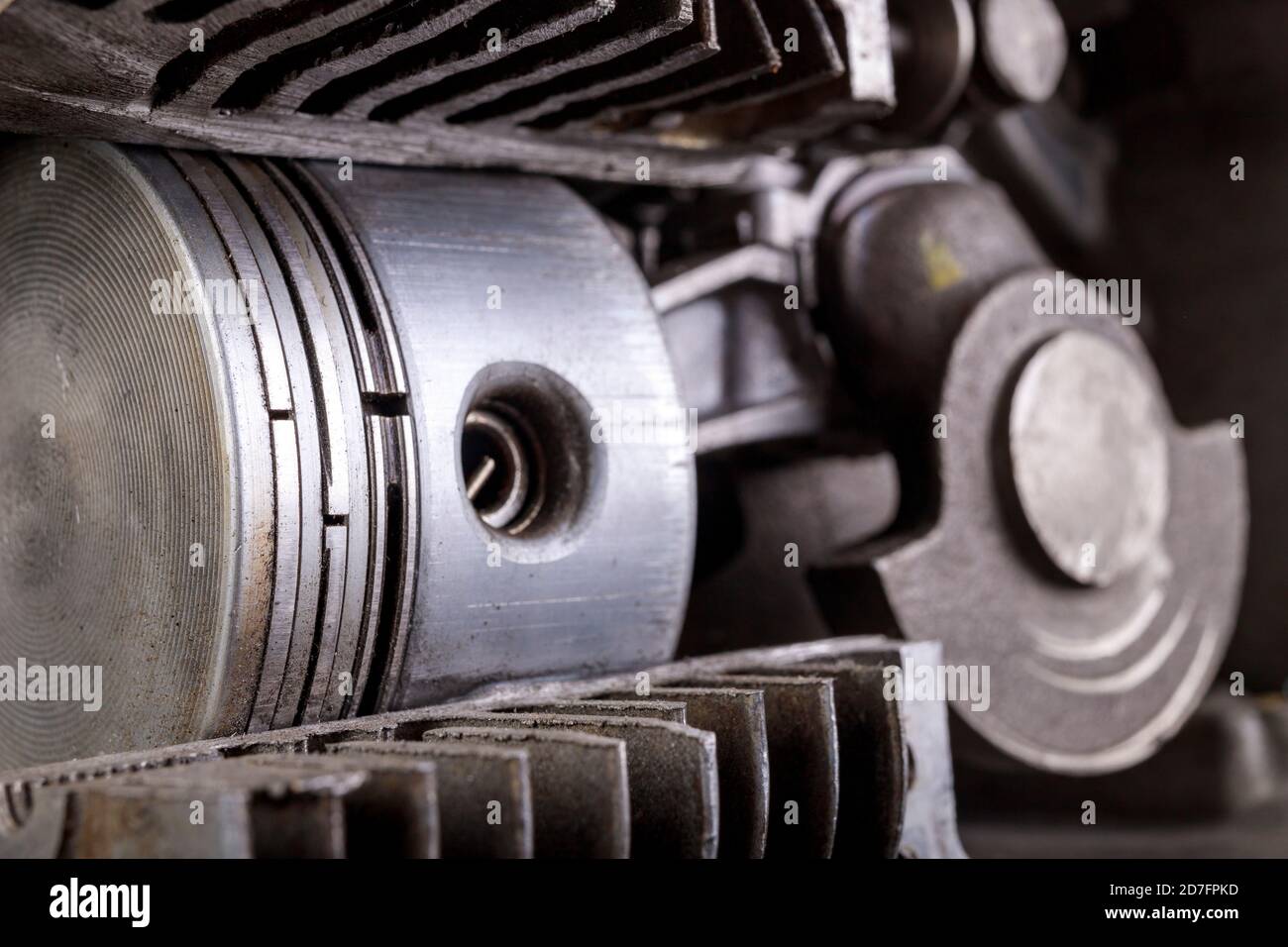 A small internal combustion engine shown in section. View of the piston