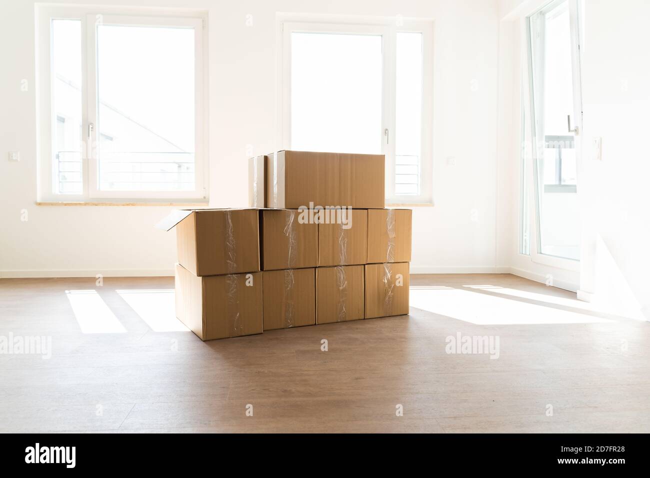 Empty Room With Moving Boxes Or Cartons Stock Photo Alamy