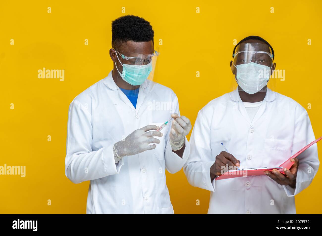Two men wearing yellow coats hi-res stock photography and images - Alamy