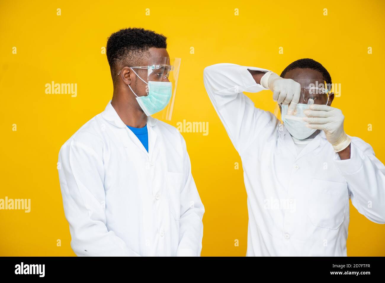 black medical persons in lab coats carrying out a study and tests Stock Photo