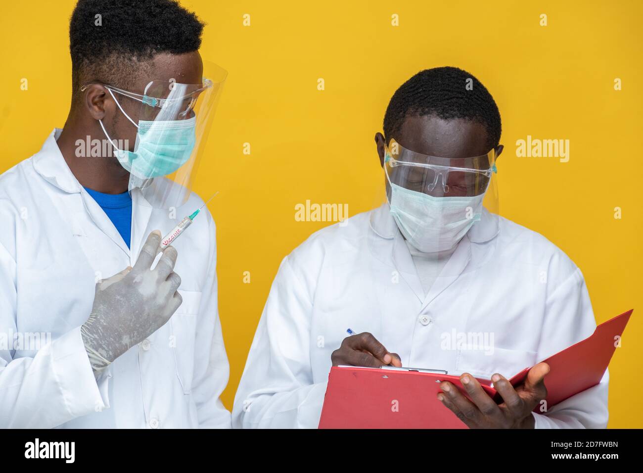 african medical persons in lab coats carrying out a study and tests Stock Photo