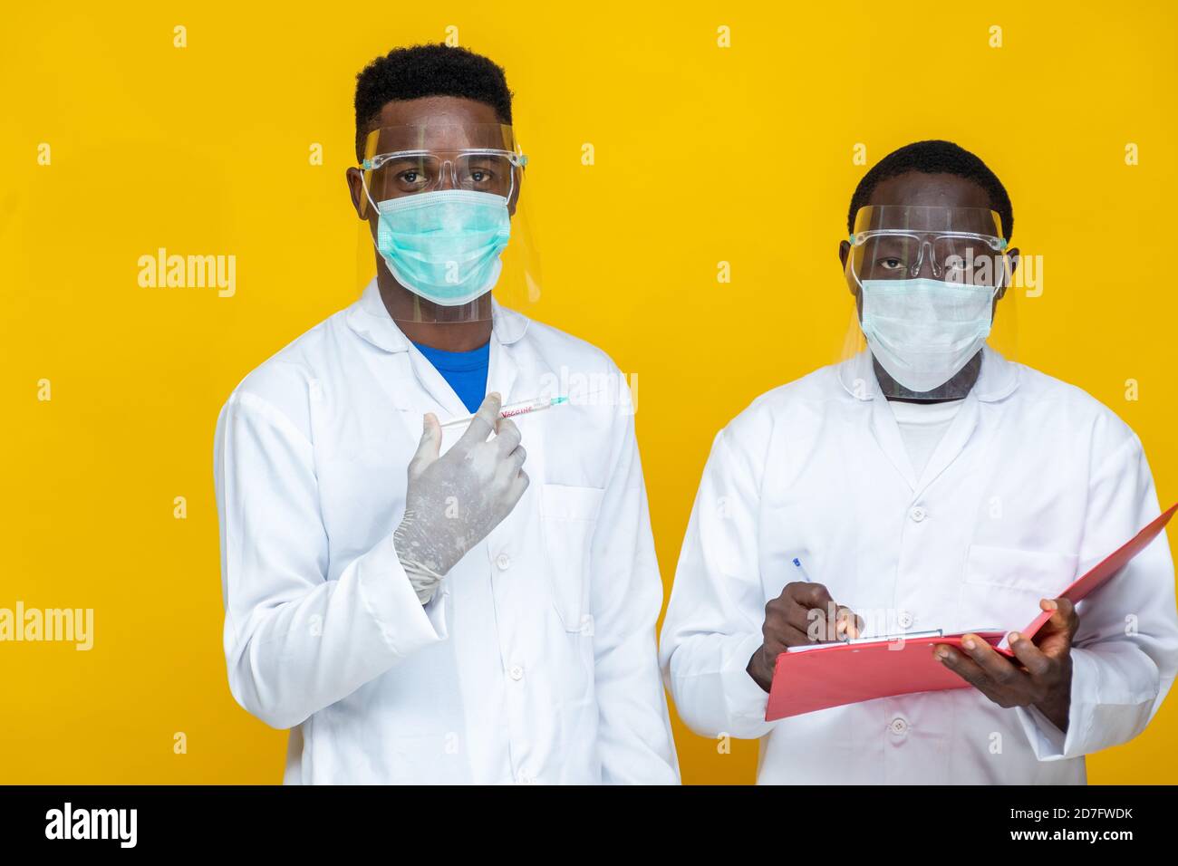 portrait of african medical persons in lab coats carrying out a study and tests Stock Photo