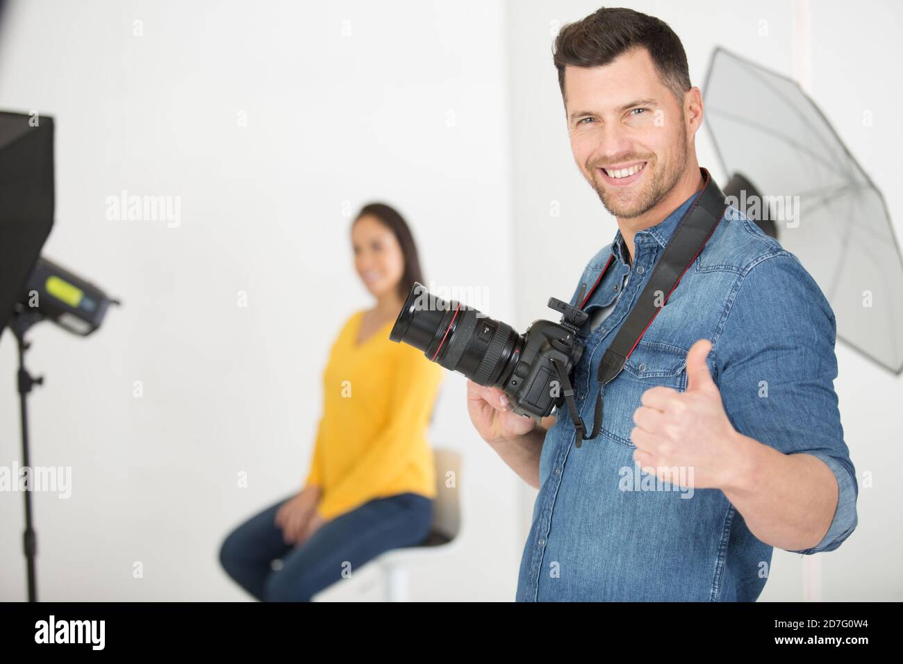 Photographer up a ladder hi-res stock photography and images - Alamy