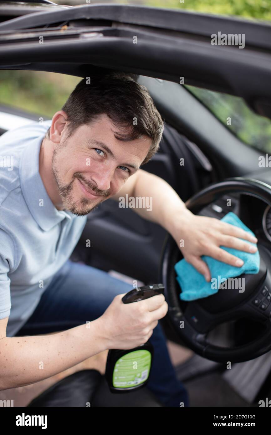 worker on a car wash cleaning car interior Stock Photo Alamy