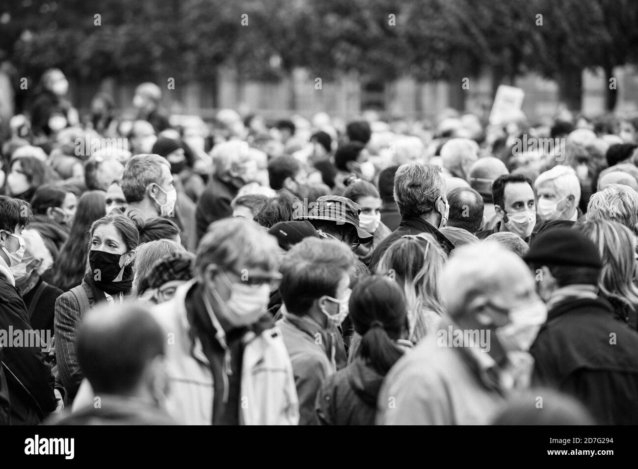 Strasbourg, France - Oct 19, 2020: Black and white image of people pay tribute to history teacher Samuel Paty, beheaded on Oct 16th after showing caricatures of Prophet Muhammad in class Stock Photo