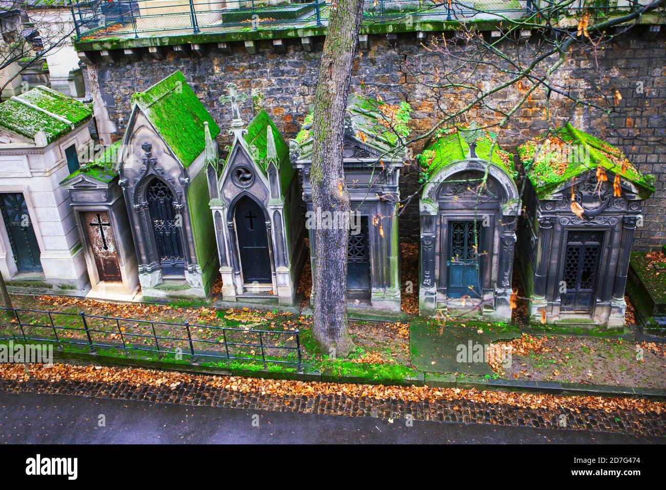 Ancient crypts in a row . Montmartre cemetery in the autumn Stock Photo