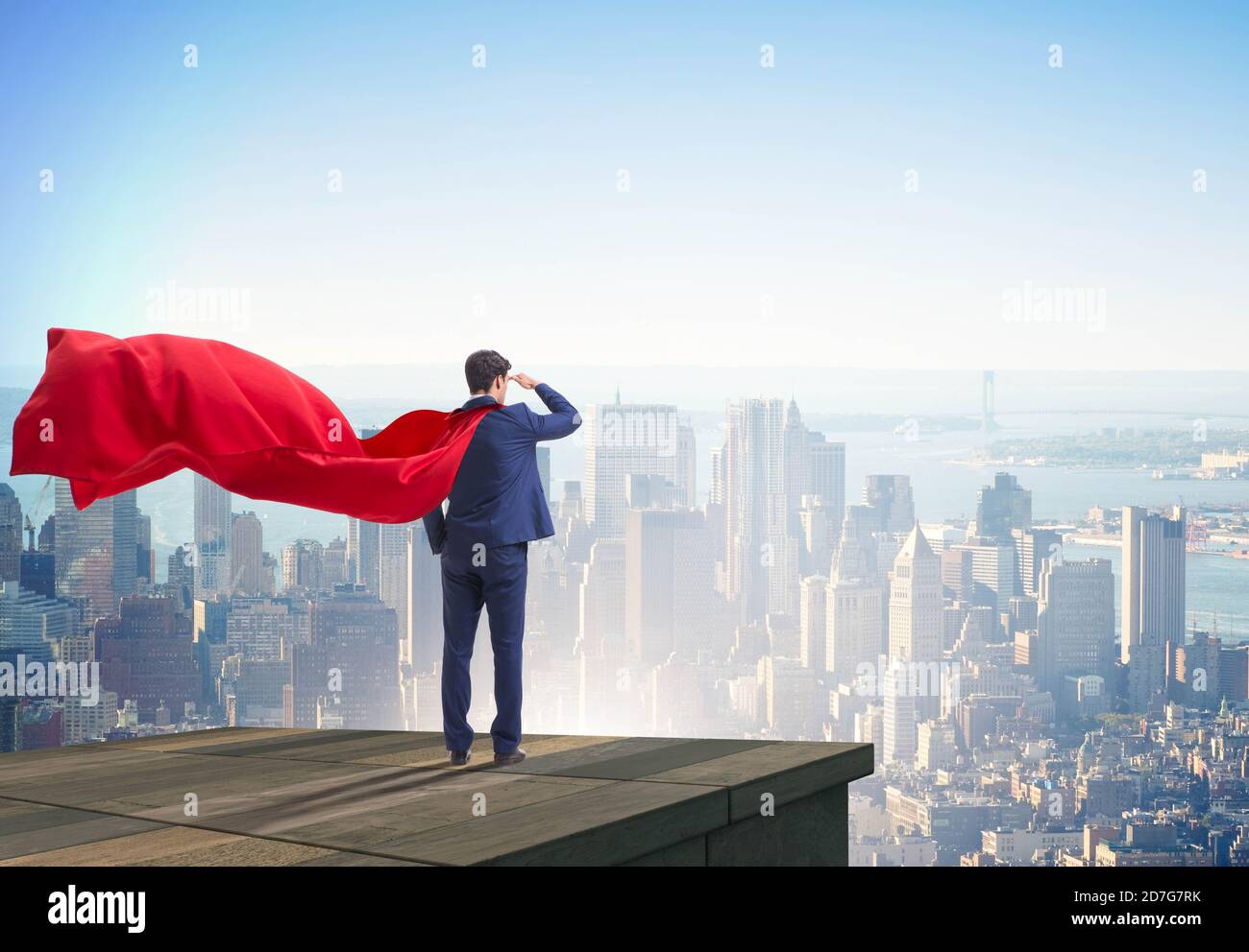The super hero businessman on top of building ready for challenge Stock ...