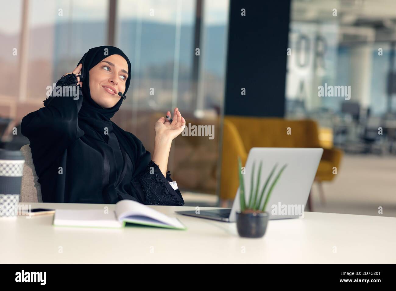 Happy muslim businesswoman in hijab at office workplace. Smiling Arabic ...