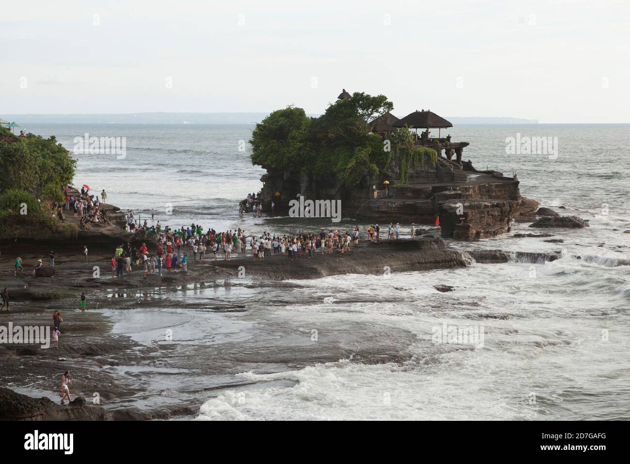 Tanah Lot is The best Sunset with beauty of the rocks and the waves. Hear The sound of waves become in good feeling. Stock Photo