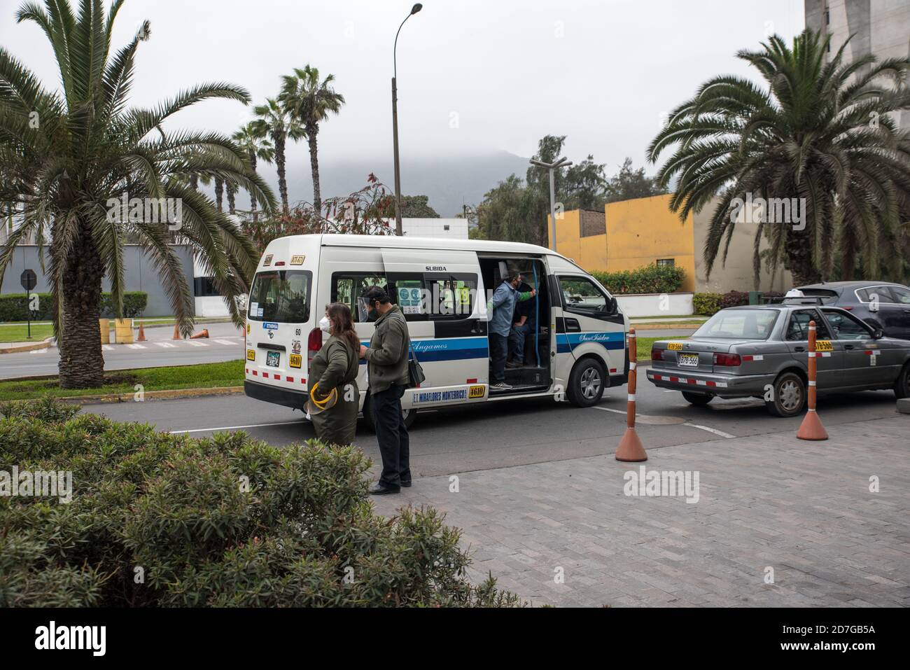 Daily street life scenes of the new normal, people working and wearing face masks in Lima, Perú. Stock Photo