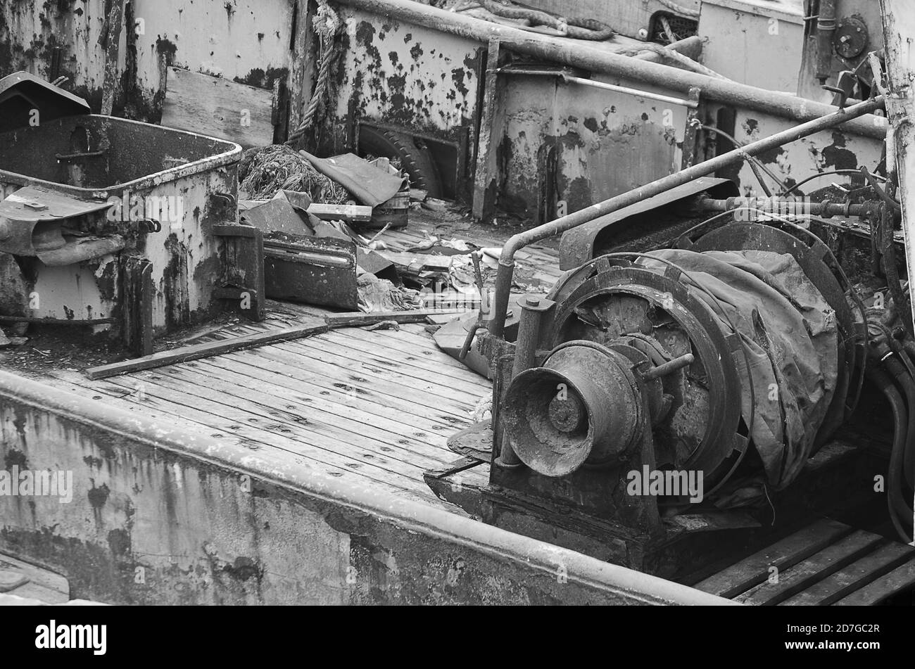 Grayscale shot of old fishing boat machinery Stock Photo