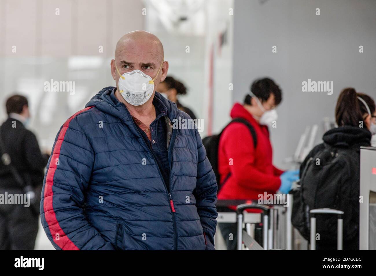 Traveller wears a face mask as a precaution at Toronto's Pearson