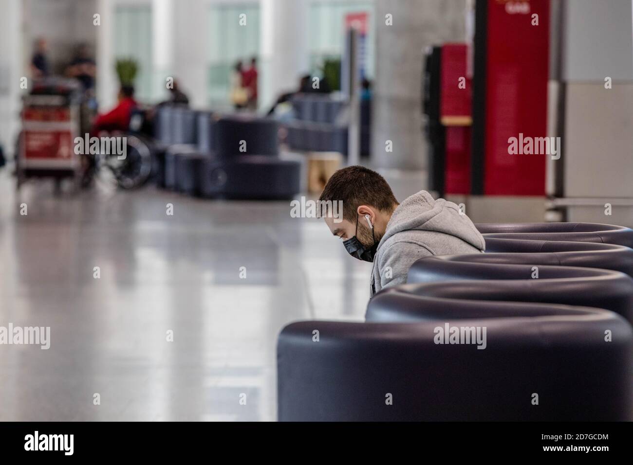Person wears a face mask as a precaution at Toronto's Pearson