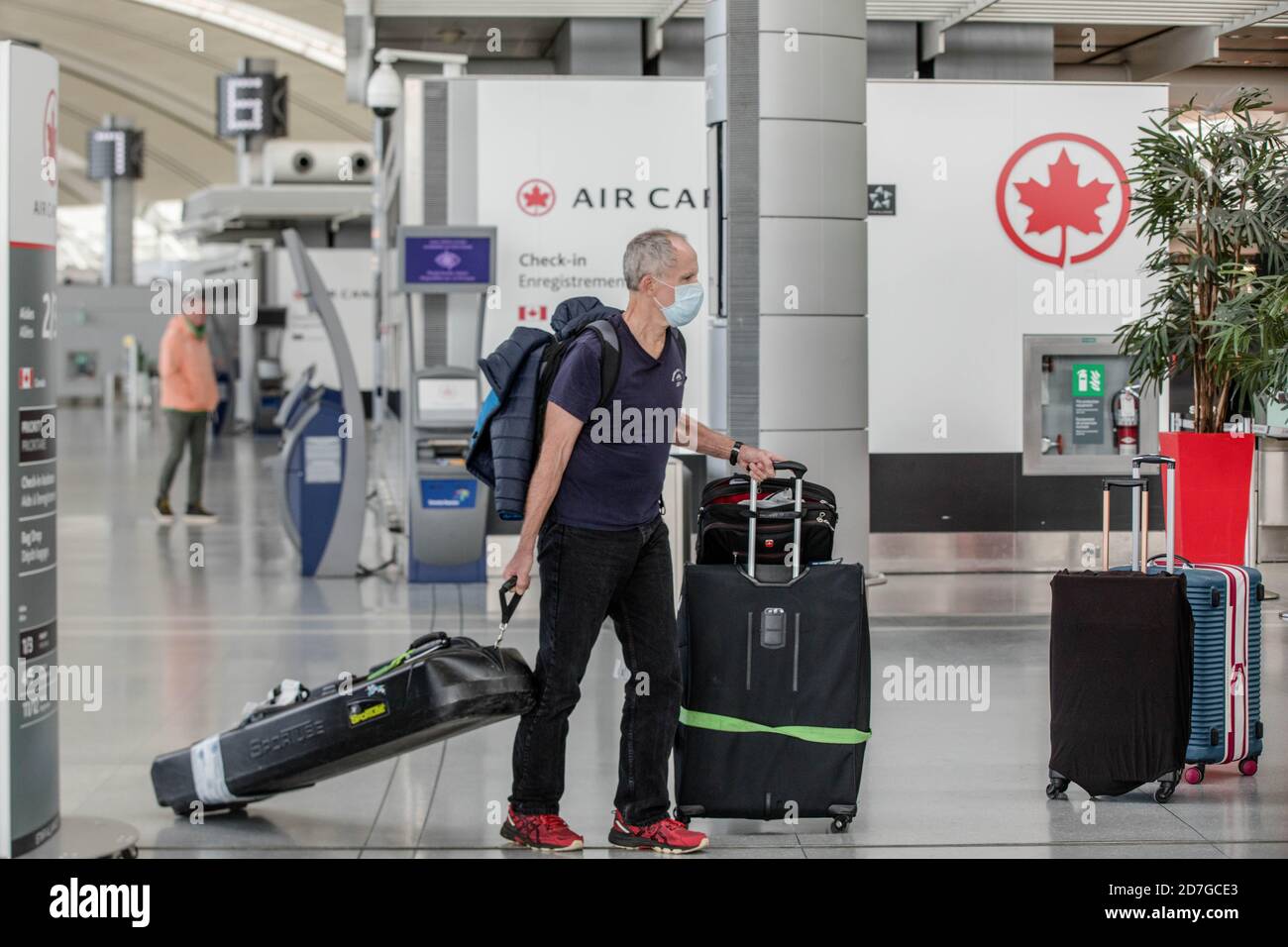 Traveller wears a face mask as a precaution at Toronto's Pearson