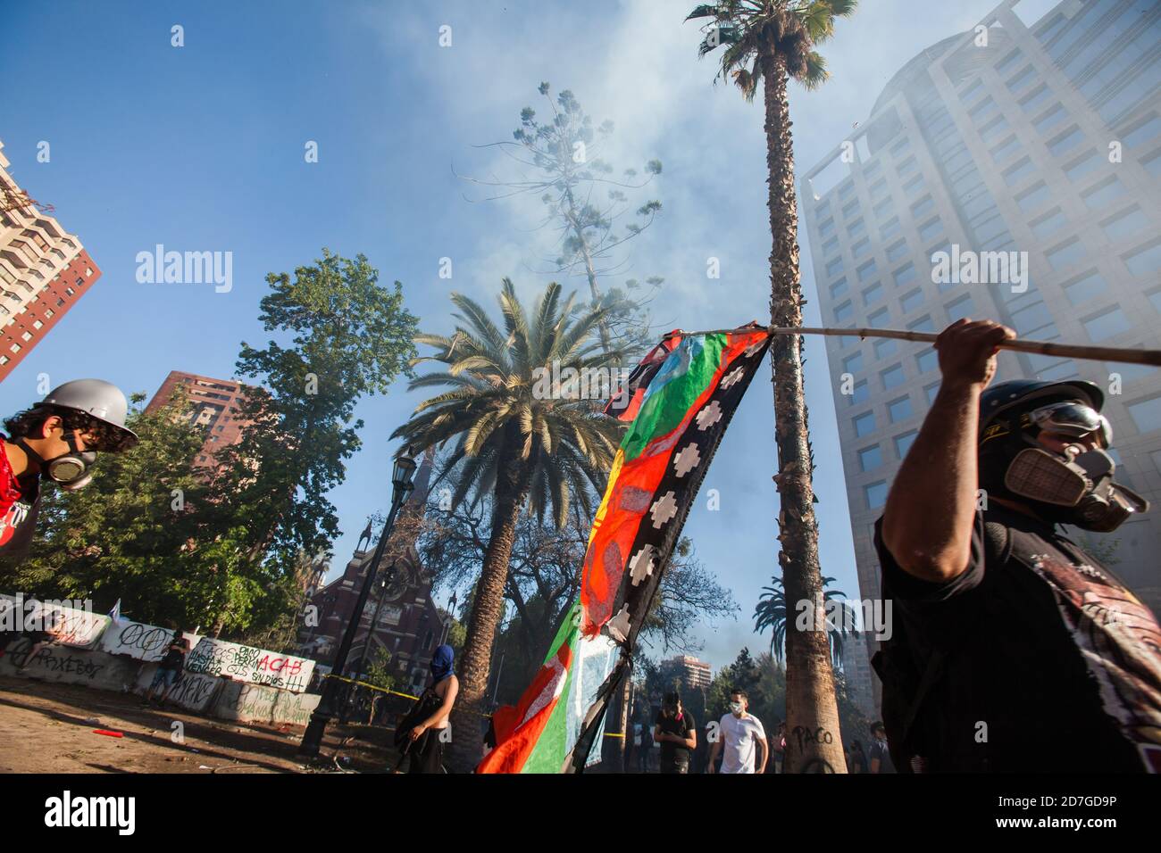 SANTIAGO, CHILE-OCTOBER 18, 2020 - People loot and burn a office building during a protest, one year after the social outbreak of October 18. Stock Photo