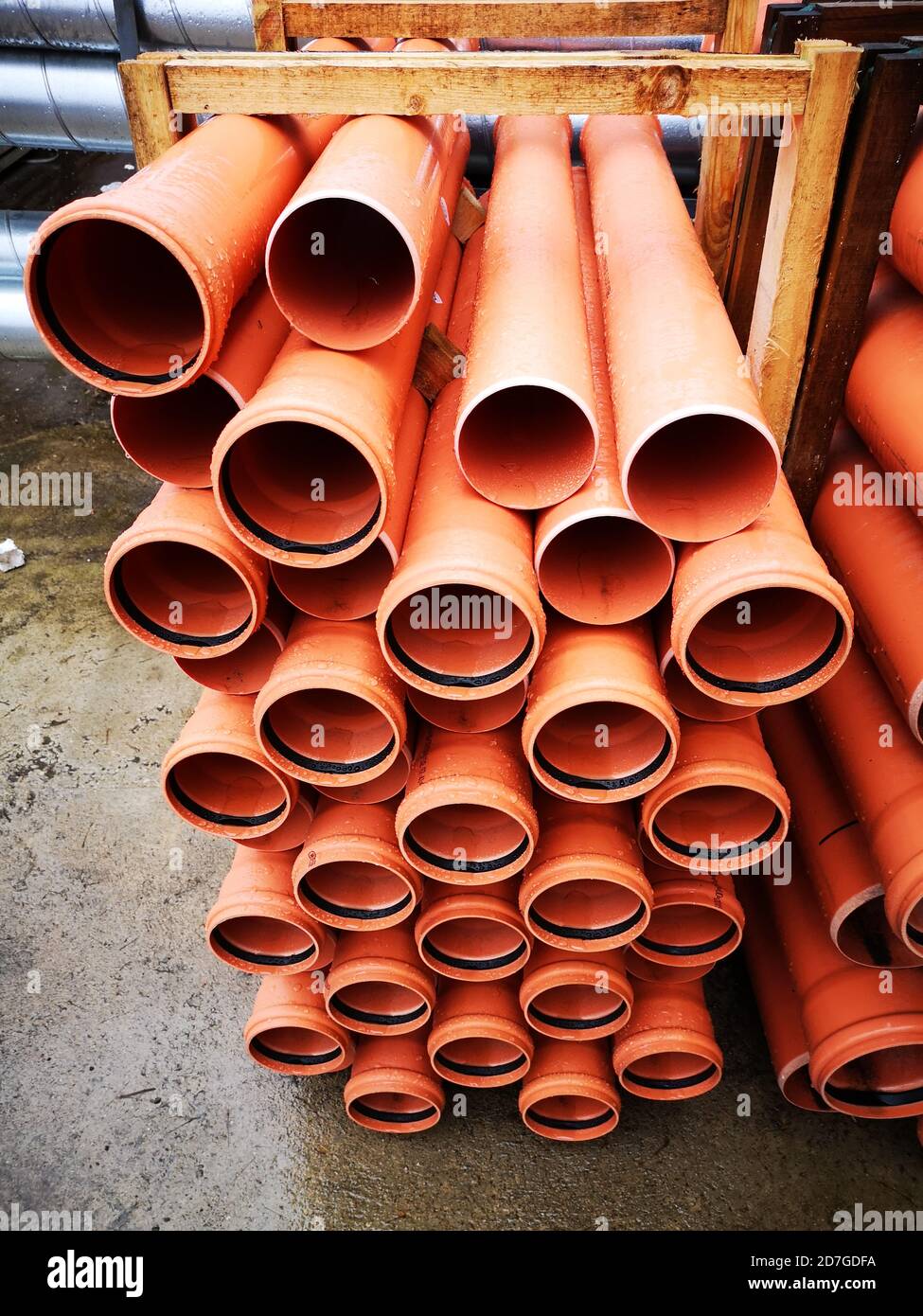 New plastic pipe stack in warehouse Stock Photo