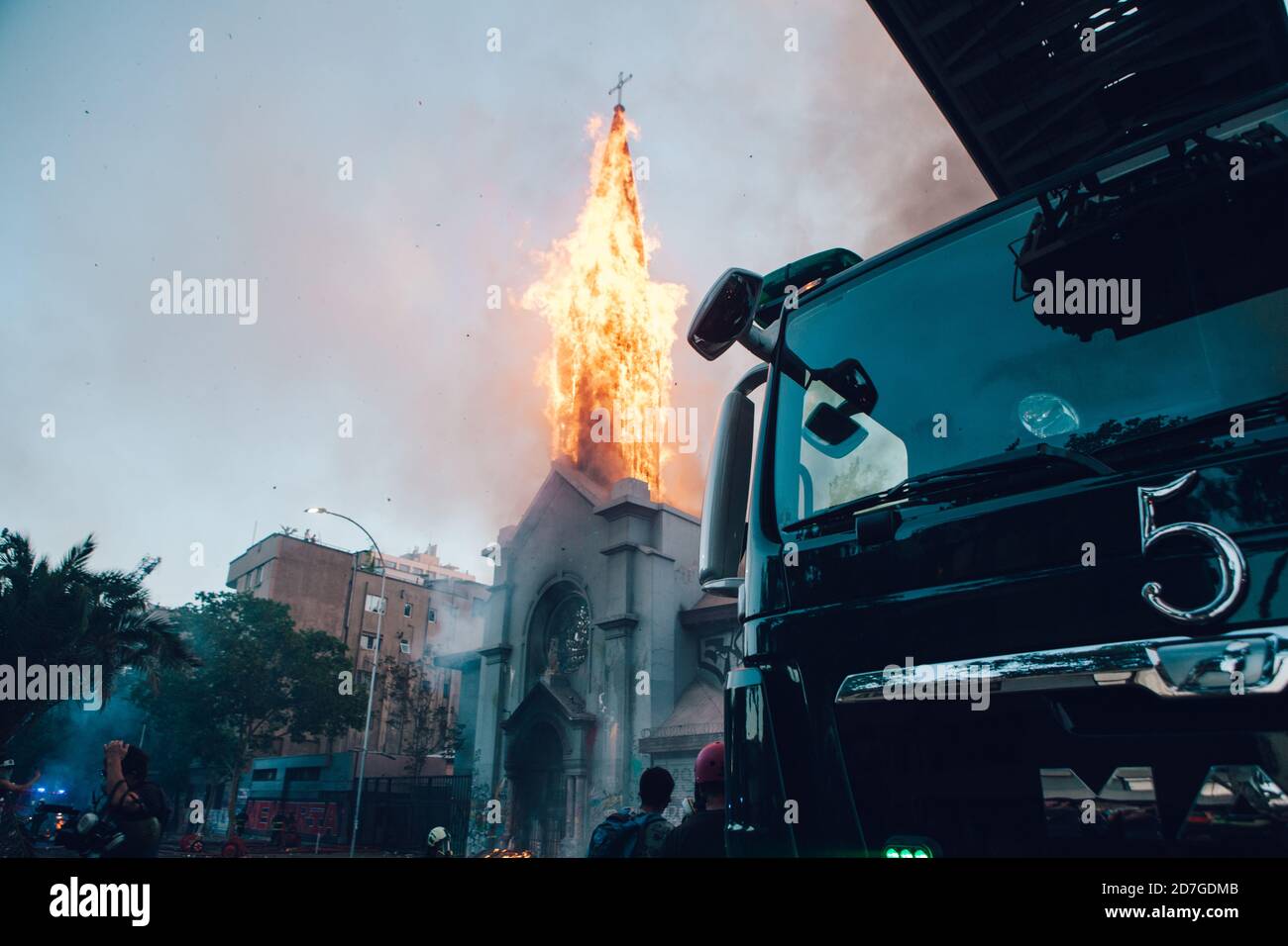 SANTIAGO, CHILE-OCTOBER 18, 2020 - La Asuncion church burns during a protest, one year after the social outbreak of October 18. Stock Photo