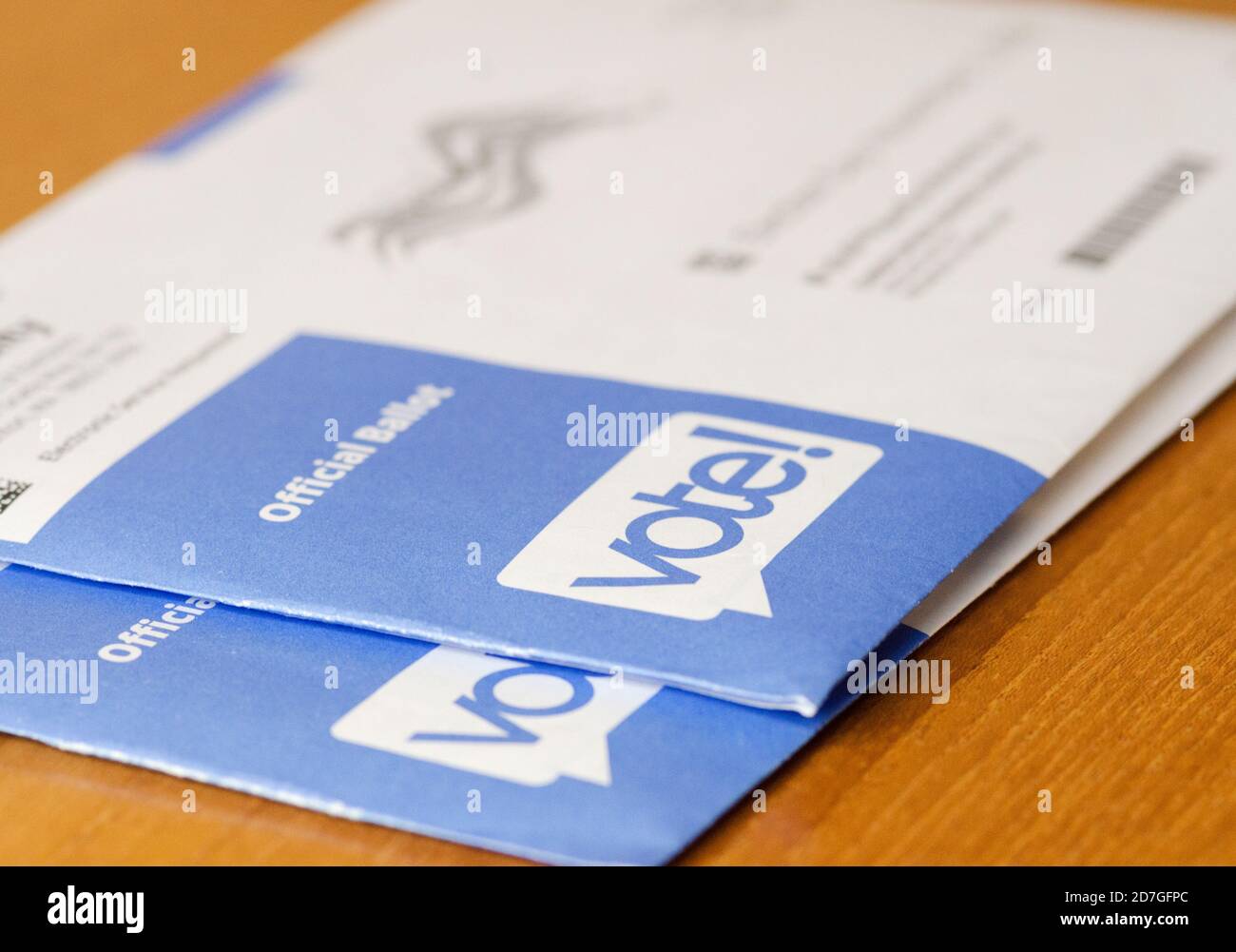 Two official ballots still in envelopes waiting to be filled out and mailed in or dropped off at a ballot drop box. Stock Photo
