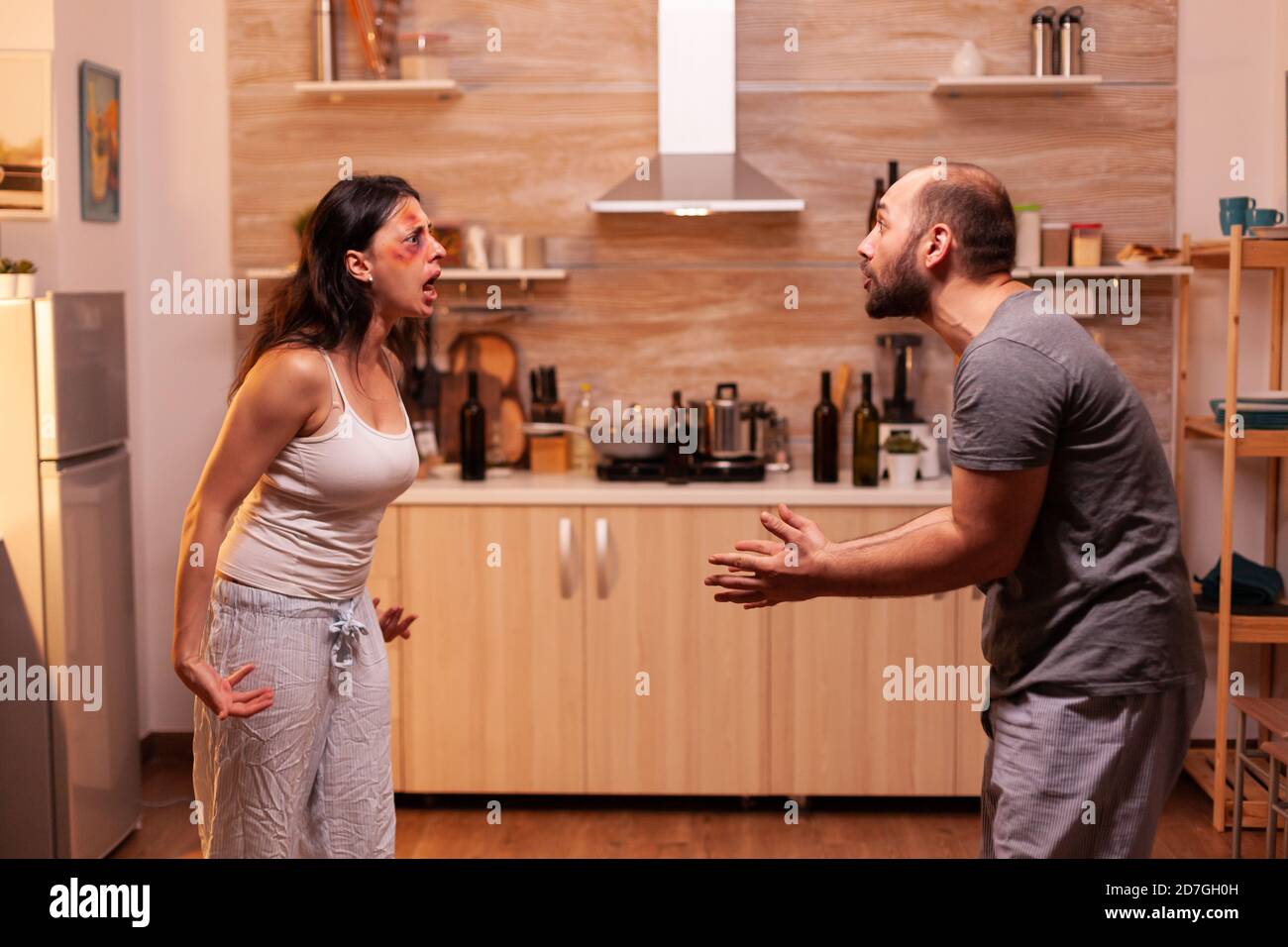 Angry couple with alcohol problems. Abused terrified beaten wife ...