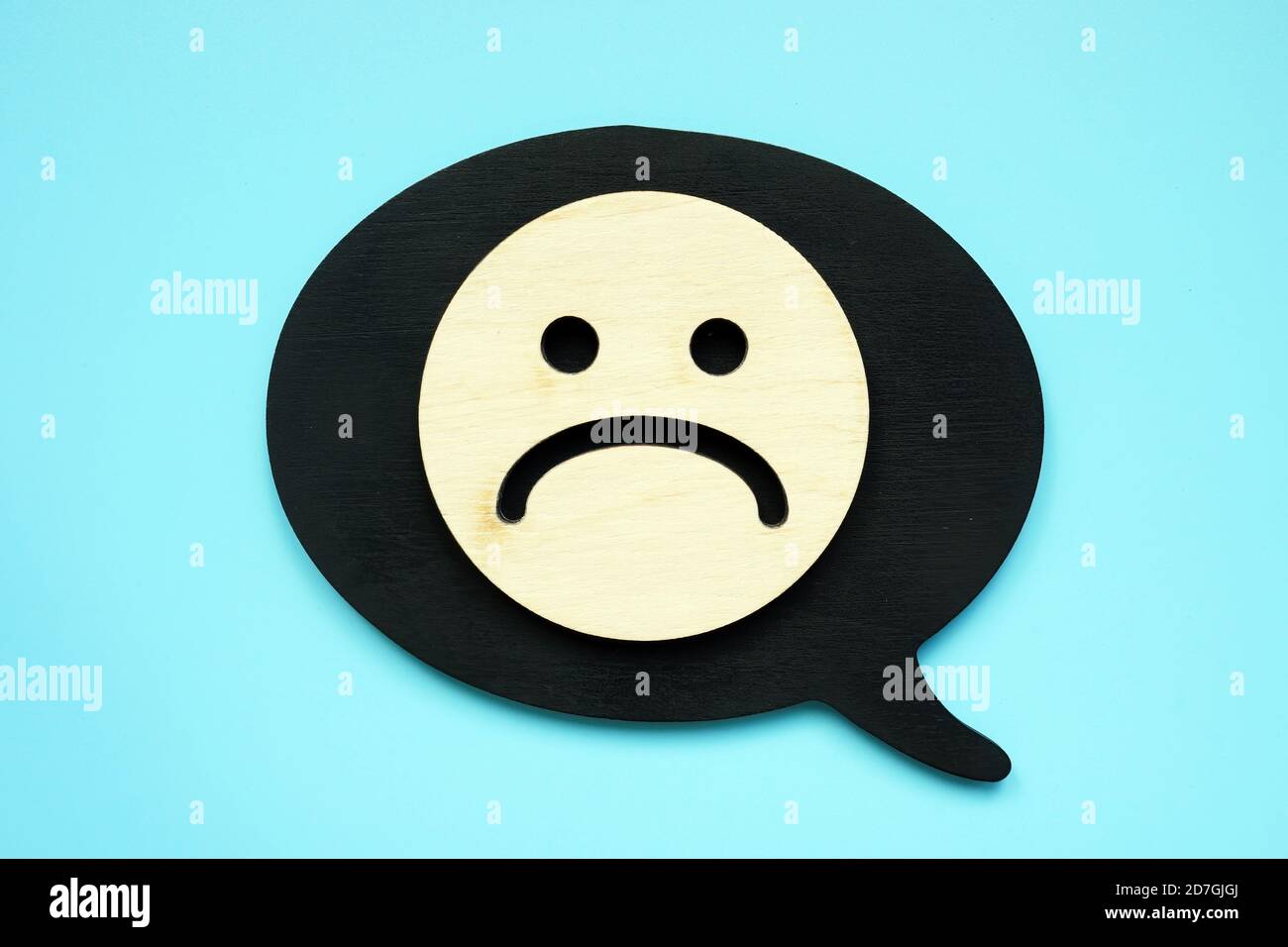Sad face as symbol of negative feedback or review. Stock Photo
