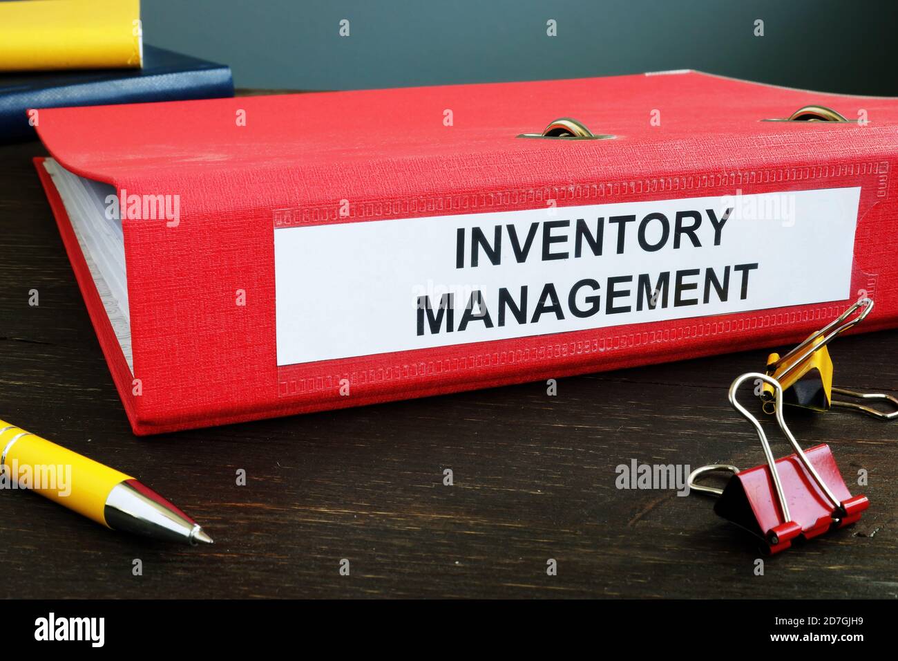 Folder with papers about Inventory Management and pen. Stock Photo