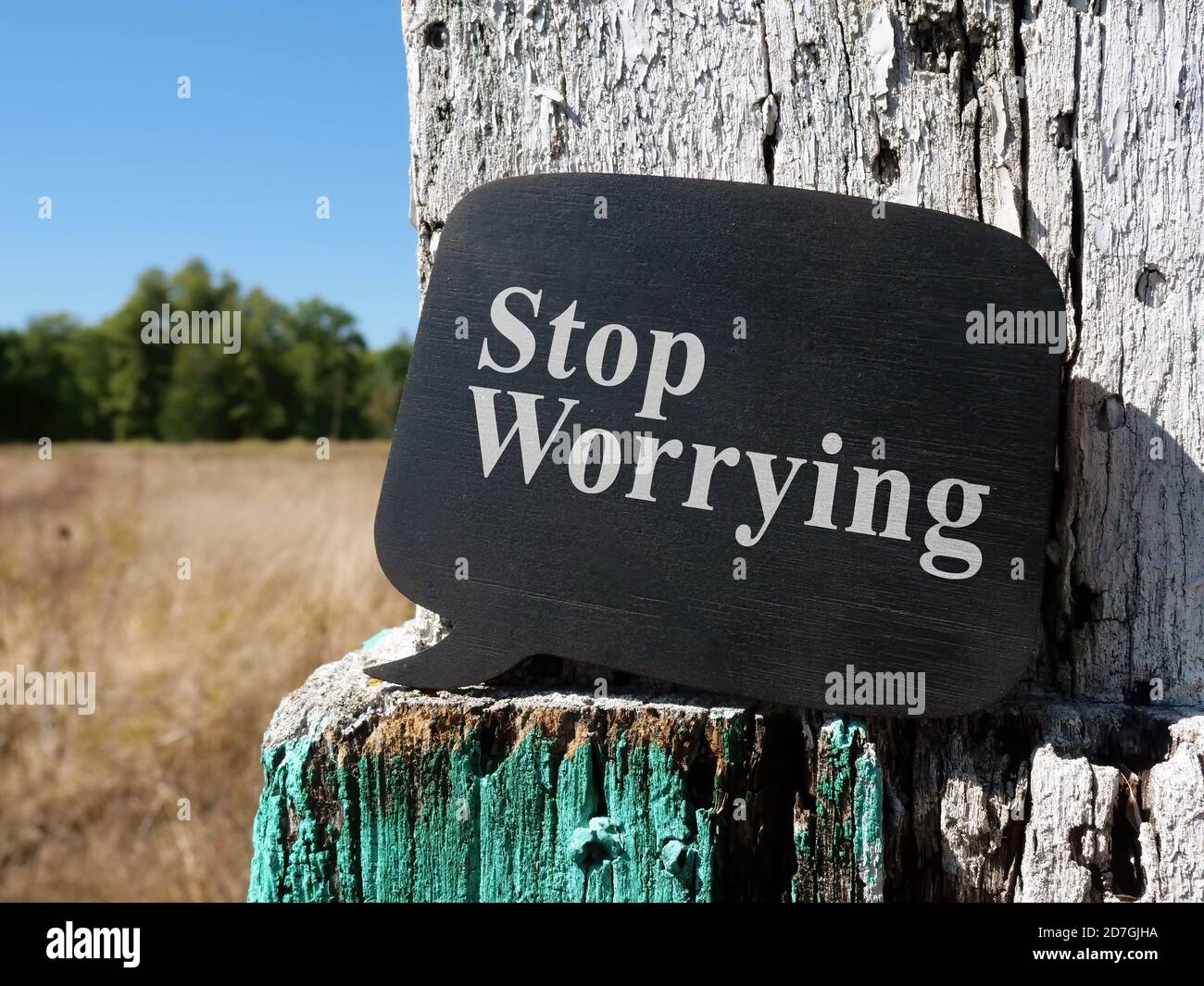 Stop worrying phrase on the wooden plate. Stock Photo