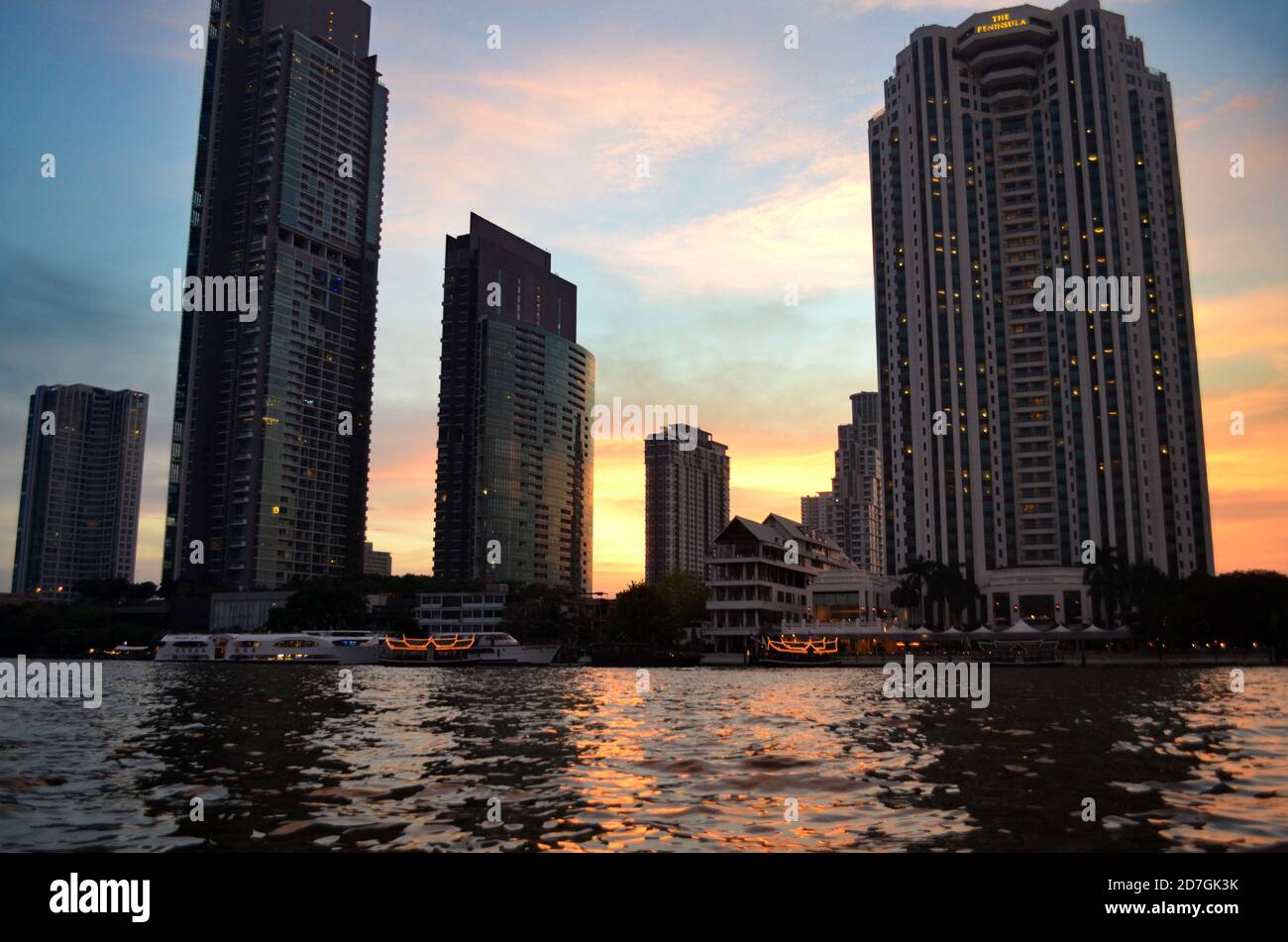 Bangkok, Thailand - Skyscrapers at Sunset from the Chao Phraya River ...
